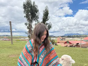 A baby alpaca, and a borrowed poncho