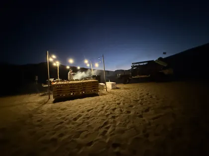 The grill going under string lights