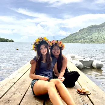 My daughter Lila and myself wearing flower crowns after her arrival to the island